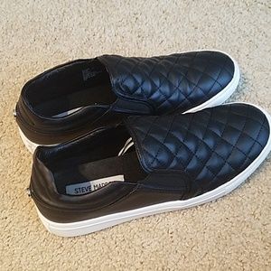 Steve Madden black slip-ons